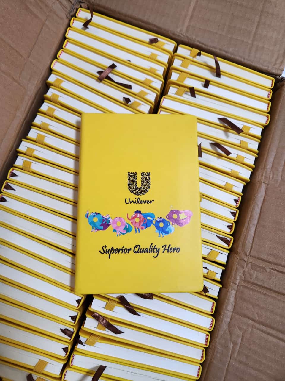 Bulk branded corporate notebook printing run boxed and ready for dispatch at Almasi Prints, Nairobi