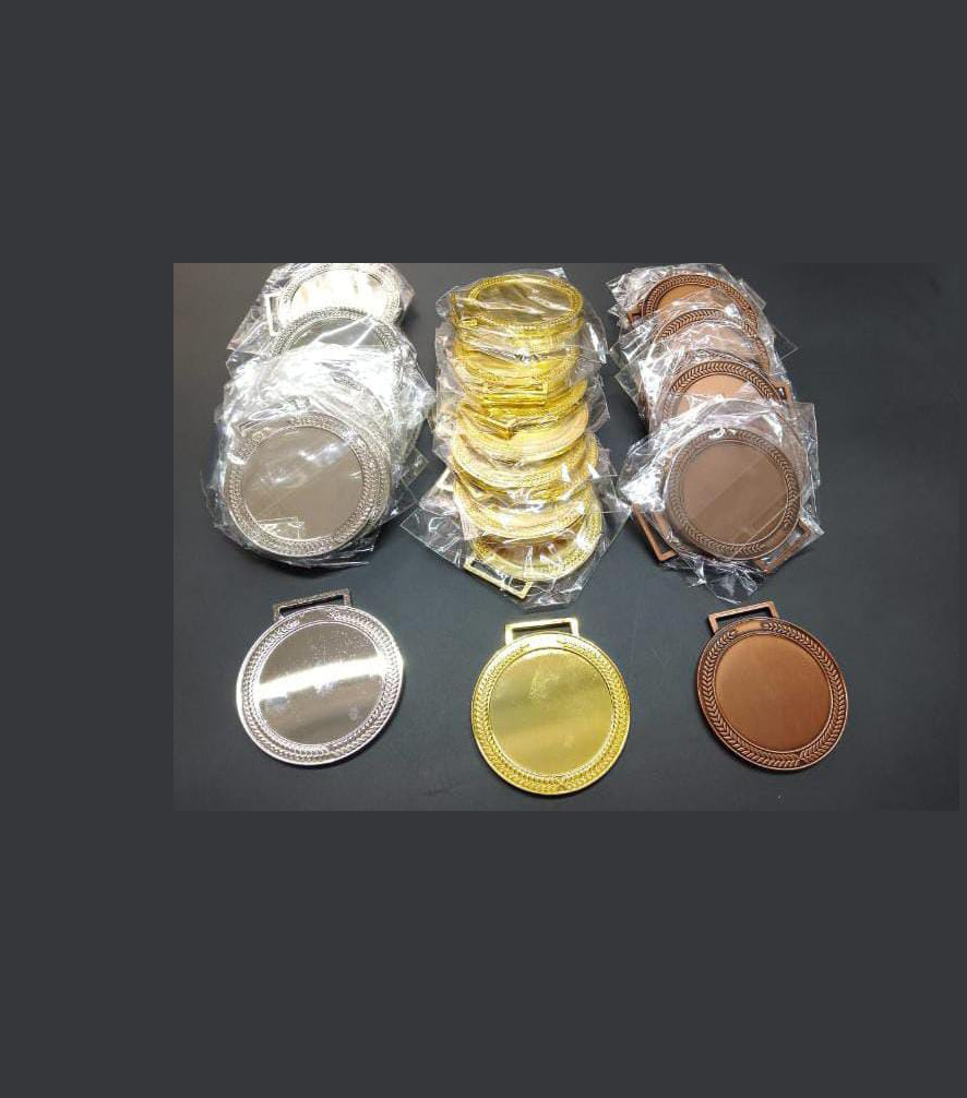 Medal engraving in Nairobi by Almasi Prints, gold silver and bronze medals with blank centres ready for engraving