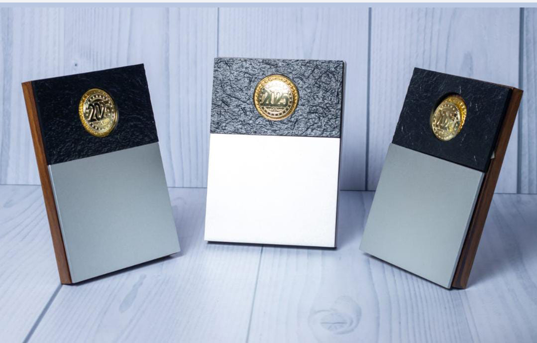 Slate and metal plaque engraving in Nairobi by Almasi Prints, textured slate plaques with brushed metal panels and year medallions