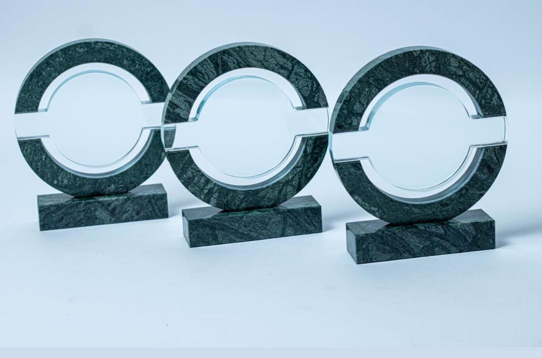 Stone and marble award engraving in Nairobi by Almasi Prints, green marble circular awards with glass centres