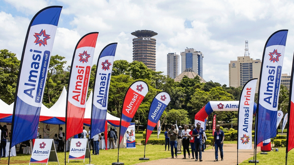 Branded teardrop and feather flags outdoors at an event in Nairobi by Almasi Prints